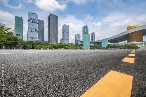 Panoramic skyline and modern business office buildings with empty road,empty concrete square floor © MyCreative