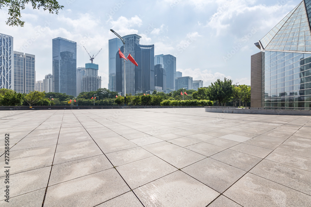 Panoramic skyline and modern business office buildings with empty road,empty concrete square floor Panoramic skyline and modern business office buildings with empty road,empty concrete square floor