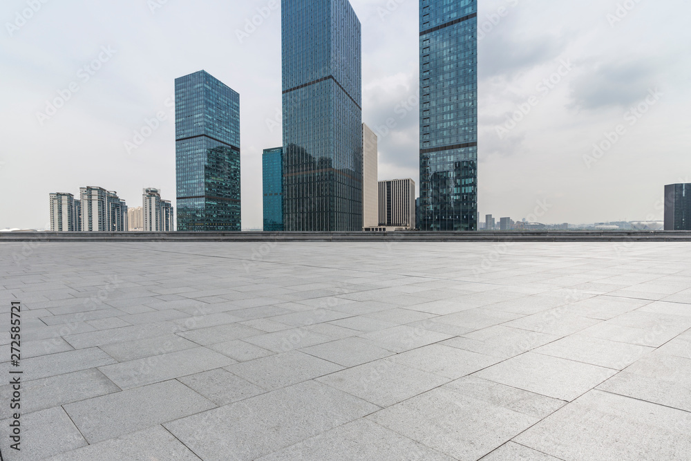 Panoramic skyline and modern business office buildings with empty road,empty concrete square floor