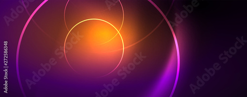 Shiny neon lights, dark abstract background with blurred magic neon light curved lines