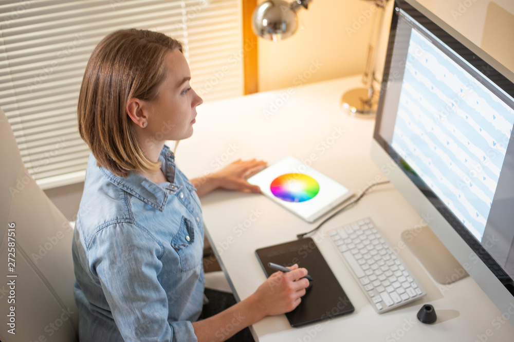 Girl graphic web designer. working on a project. work with color. freelance designer Girl graphic web designer. working on a project. work with color. freelance designer