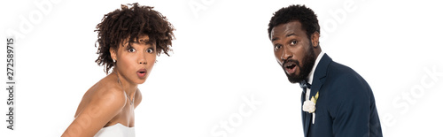 Φωτογραφία panoramic shot of surprised african american bride and bridegroom isolate on whi