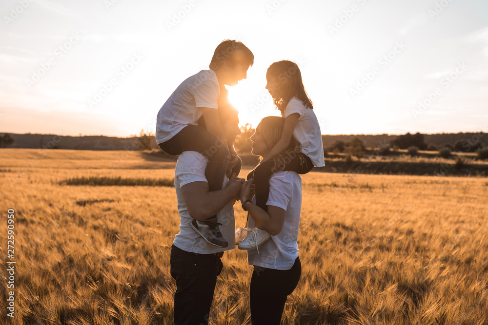 Portrait of a happy and fun family in the countryside. Concept of love family