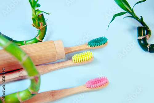 Flat lay composition with bamboo toothbrush and space for text