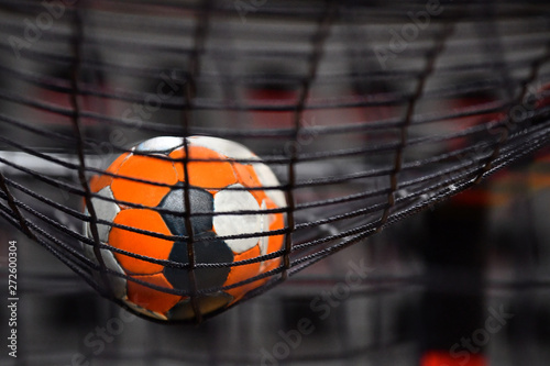 Handball ball and the net from the goal