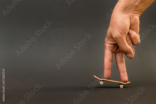 Fingerboard. A small skateboard for kids and teenagers to play w