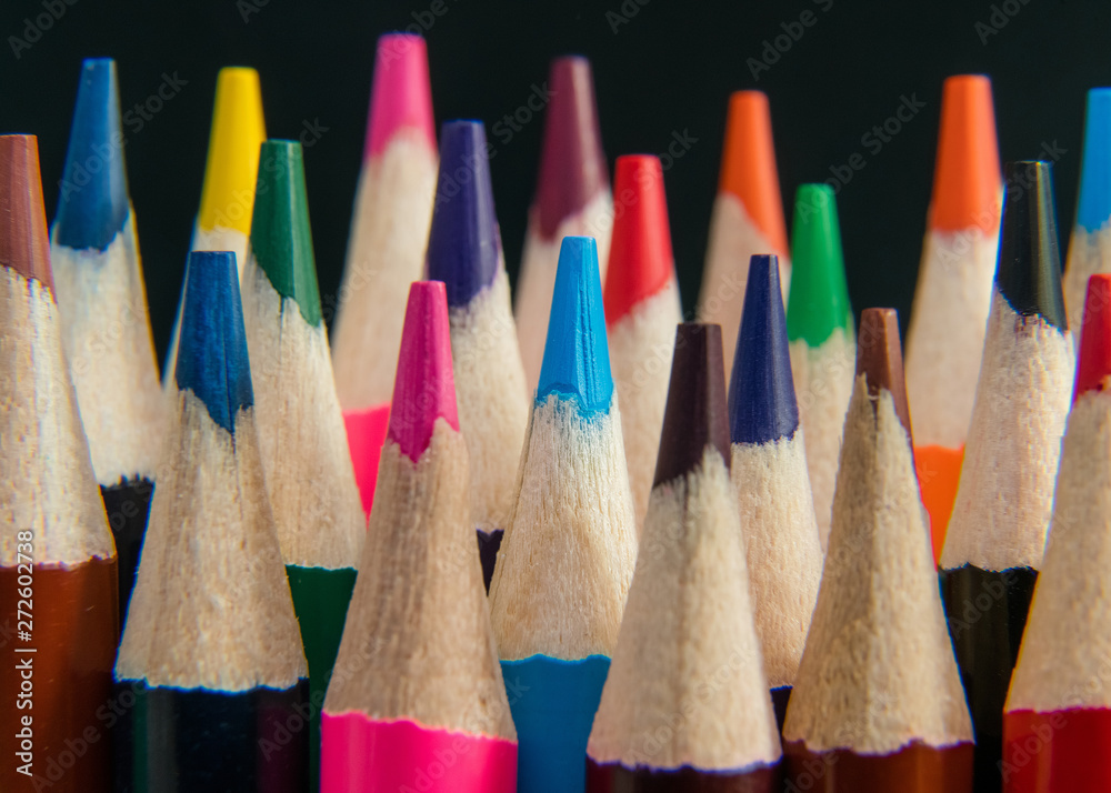 Close up of an assortment of colour pencils on black background. Close up of an assortment of colour pencils on black background.