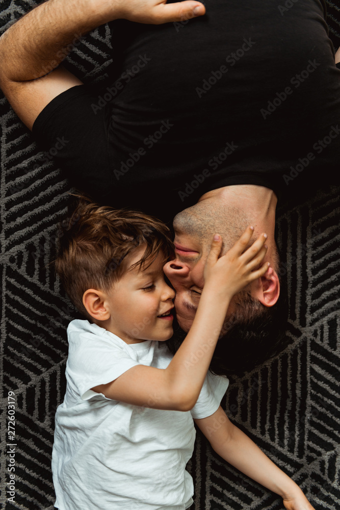 Smiling boy playing with his Dad Smiling boy playing with his Dad