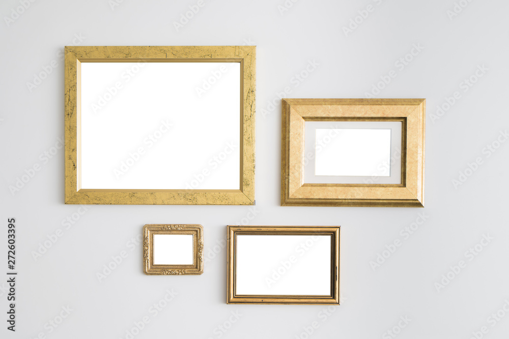 Blank empty golden frames on white background. Art gallery, muse Blank empty golden frames on white background. Art gallery, muse