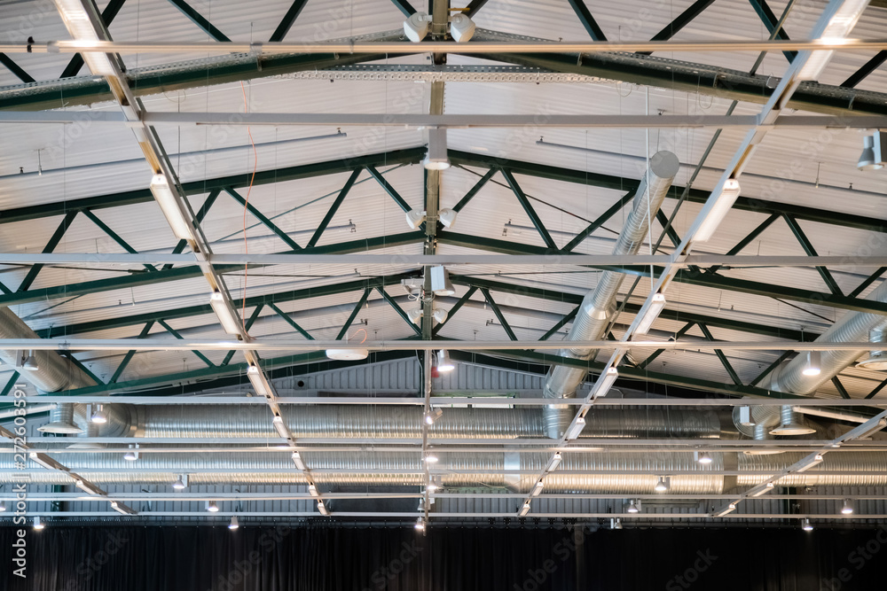 Factory building or warehouse building. Vast empty space with ve Factory building or warehouse building. Vast empty space with ve