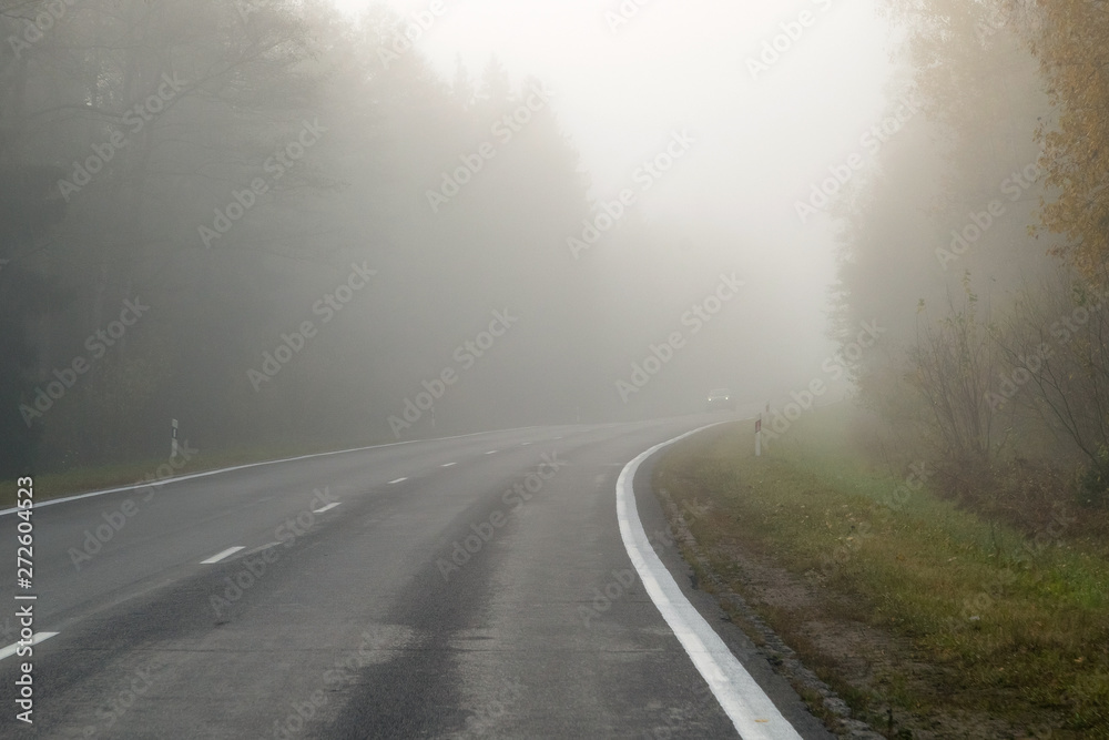 Driving on countryside road in fog. Illustration of dangers of d Driving on countryside road in fog. Illustration of dangers of d