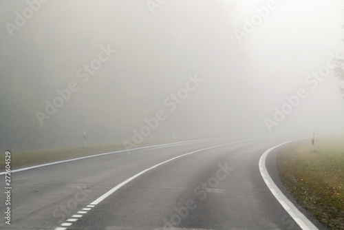 Driving on countryside road in fog. Illustration of dangers of d