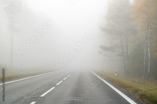Driving on countryside road in fog. Illustration of dangers of d