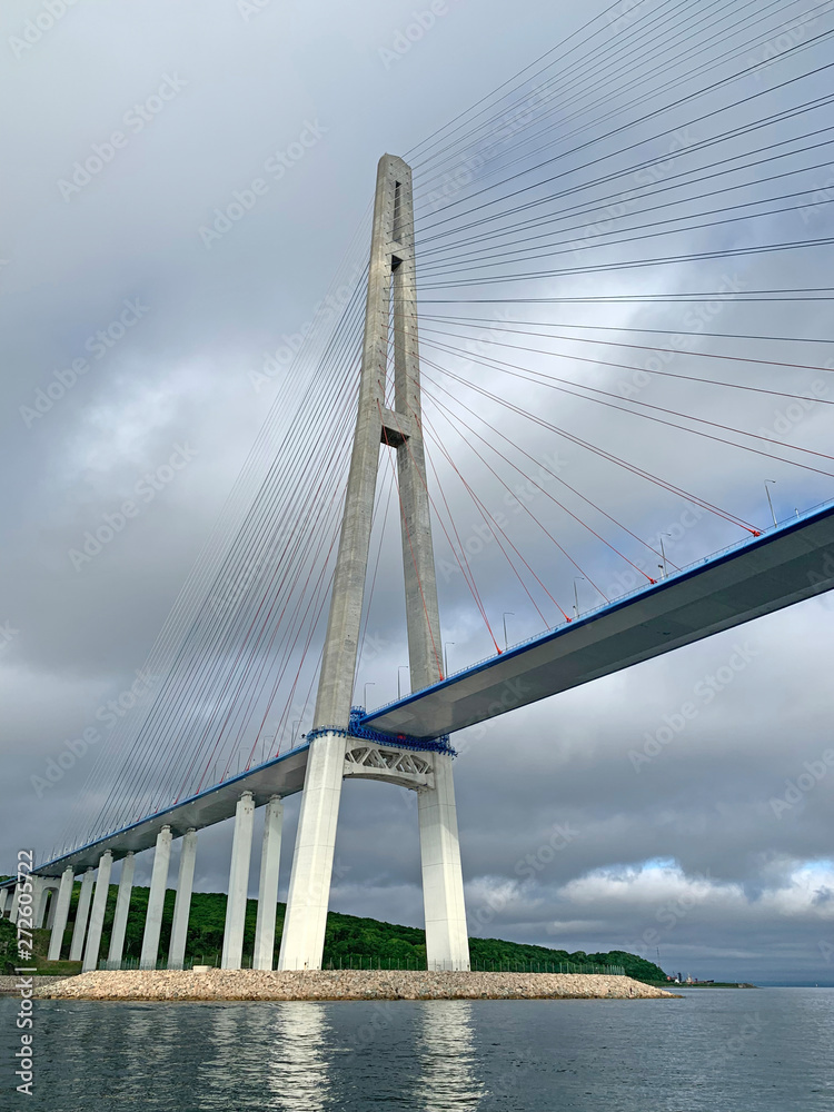 Russia, Vladivostok. Bridge to Russkiy island in cloudy summer day