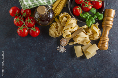 Dark surface with fresh products for cooking pasta