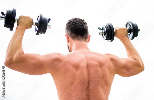 Muscular man exercising with dumbbell rear view. Actions speak louder than coaches. Sportsman with strong back and arms. Sport equipment. Bodybuilding sport. Sport lifestyle. Dumbbell exercise gym