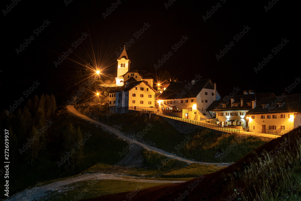 Obraz premium Ancient village of Monte Santo di Lussari (1790 m) at night in the Julian Alps. Tarvisio, Friuli Venezia Giulia, Italy, Europe