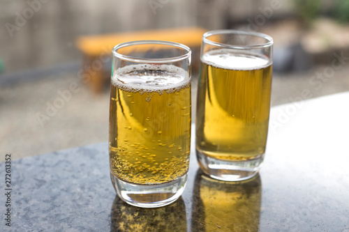 Two small glasses of fresh beer