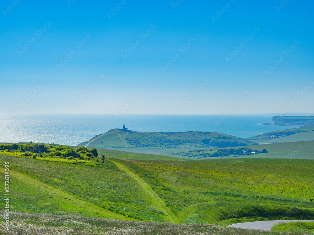 View of the white chalk headland cliffs and Beachy Head in the Seven Sisters National park, Eastbourne, East Sussex, England, UK.