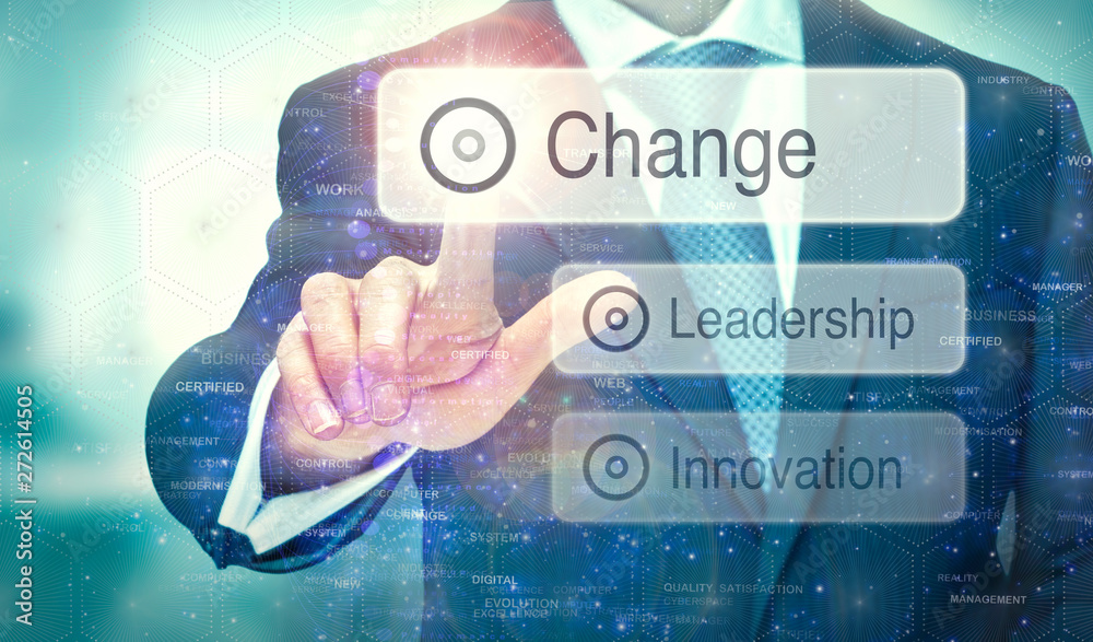 A businessman selecting a button on a futuristic display with a Change concept written on it. A businessman selecting a button on a futuristic display with a Change concept written on it.