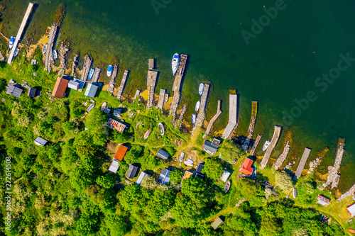 Straight down aerial of landscape full of small jetties, sheds and boats. Location Hasslo island in Blekinge archipelago, Sweden. photo