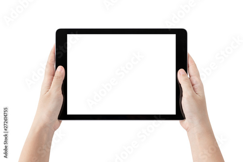 Hands holding tablet computer and blank white screen on table with clipping path.