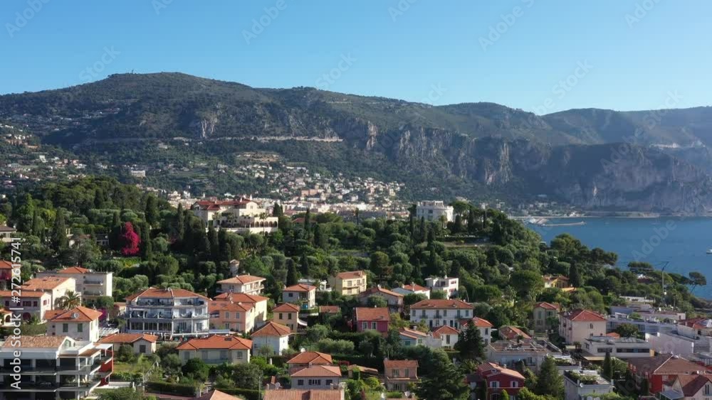 Residential luxury area Saint Jean Cap ferrat France aerial morning shot mountains in background sunny day blue sky Residential luxury area Saint Jean Cap ferrat France aerial morning shot mountains in background sunny day blue sky