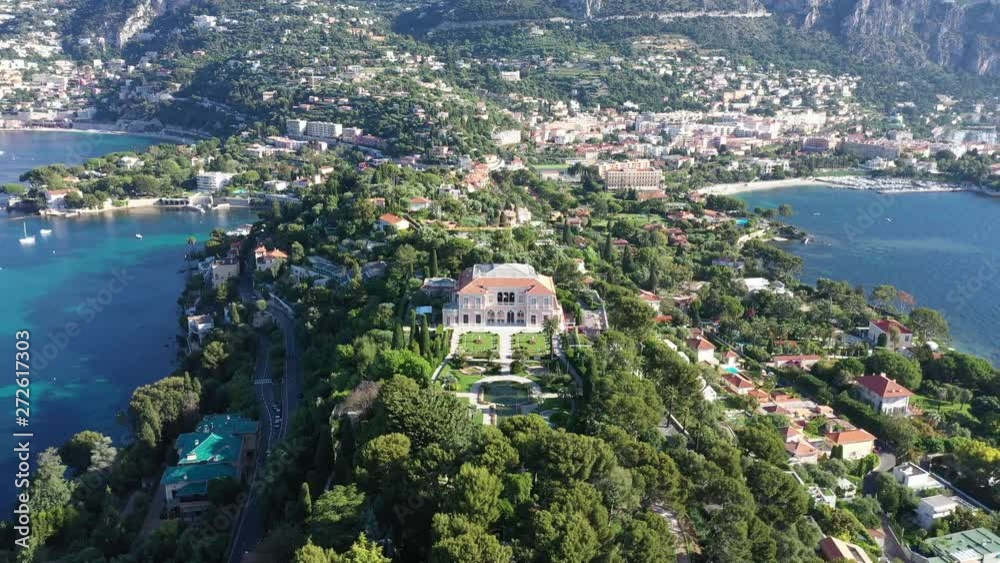 Aerial back traveling over Saint Jean Cap Ferrat south of France amazing paradise mediterranean residential area. Sunny morning