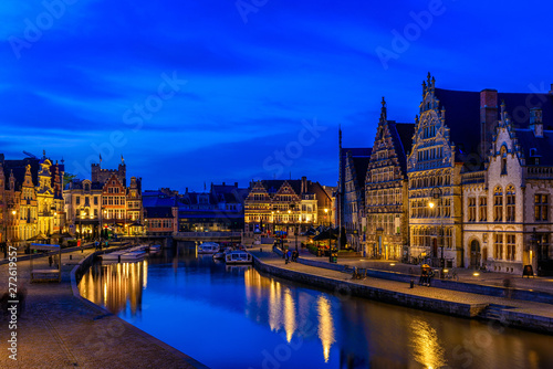 View of Graslei  Korenlei quays and Leie river in the historic city center in Ghent  Gent   Belgium. Architecture and landmark of Ghent. Night cityscape of Ghent.
