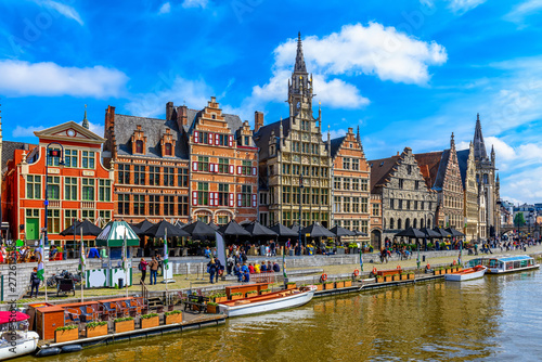View of Graslei quay and Leie river in the historic city center in Ghent (Gent), Belgium. Architecture and landmark of Ghent. Cityscape of Ghent. photo
