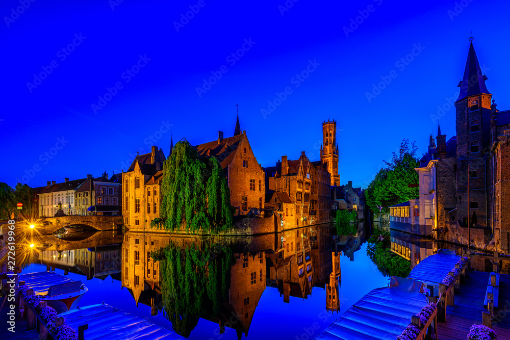 Classic view of the historic city center of Bruges (Brugge), West Flanders province, Belgium. Night cityscape of Bruges.