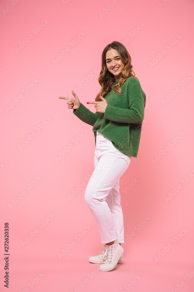 Full length image of Happy woman wearing in green sweater Full length image of Happy woman wearing in green sweater