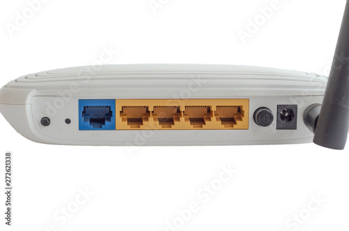 White Wi-Fi modem on an isolated background, rear view. Connectors