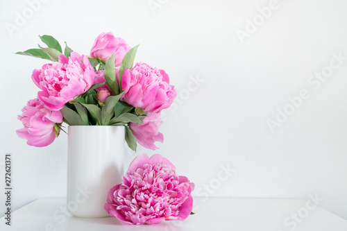 Bouquet of pink peony in vase for text on white. Mothers day.