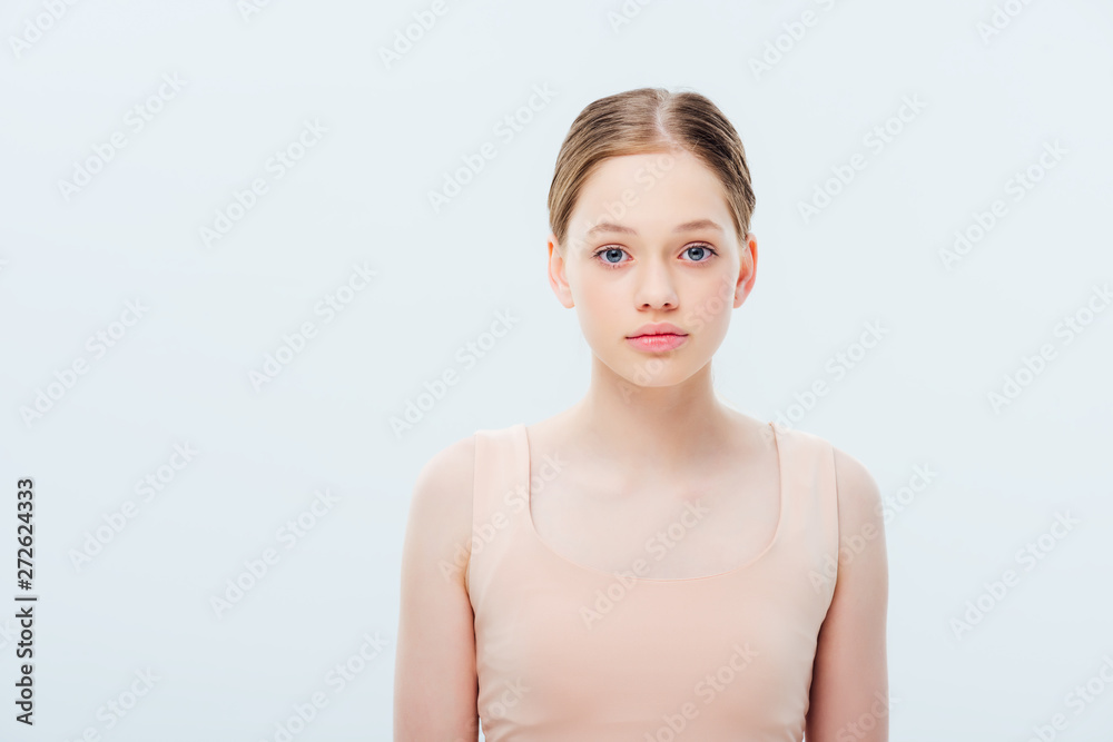 front view of serious teenage girl isolated on grey front view of serious teenage girl isolated on grey