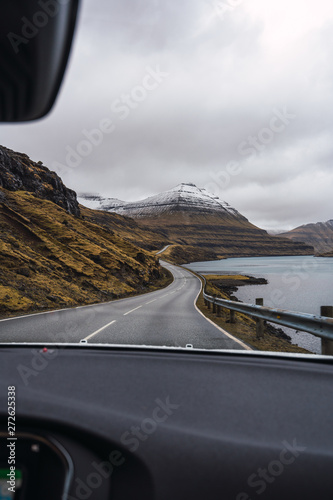 View of road and mountains through windscreen