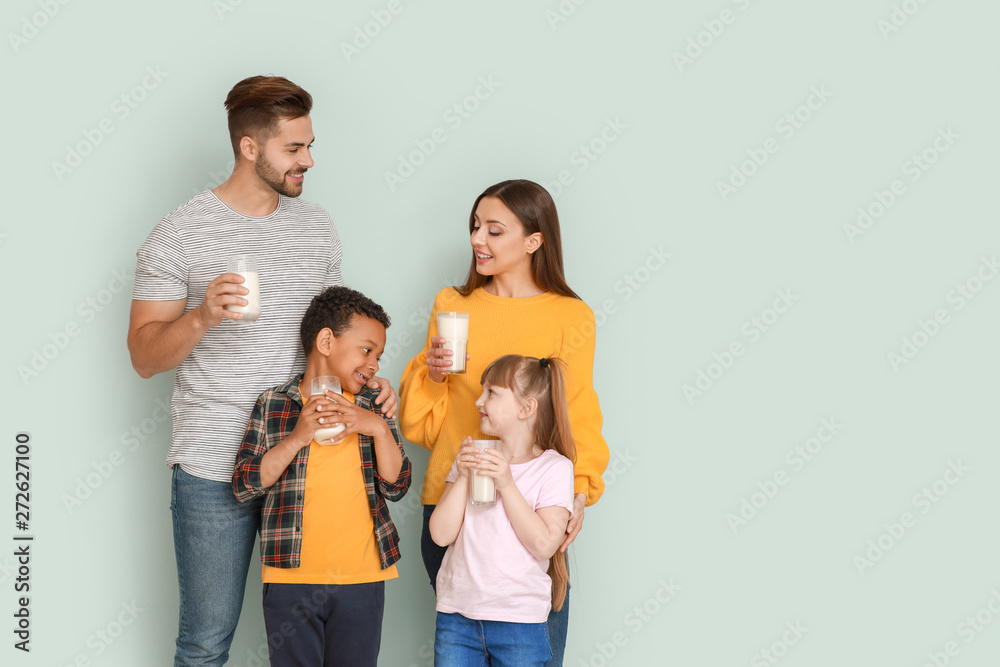 Young family with glasses of tasty milk on light background Young family with glasses of tasty milk on light background