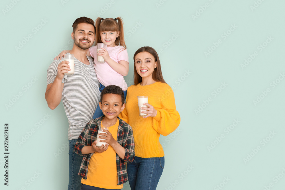Young family with glasses of tasty milk on light background Young family with glasses of tasty milk on light background