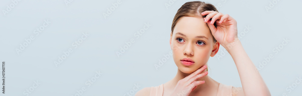 thoughtful teenage girl touching face isolated on grey, panoramic shot thoughtful teenage girl touching face isolated on grey, panoramic shot