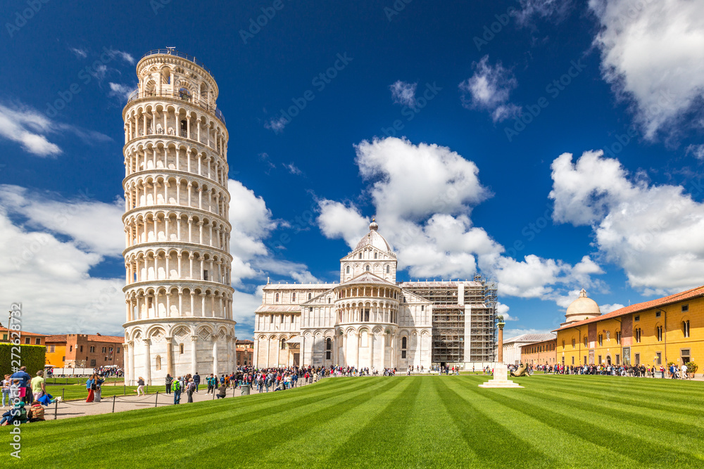 The Leaning Tower of Pisa and cathedral in Square of Miracles at sunny day, Tuscany region, Italy.
