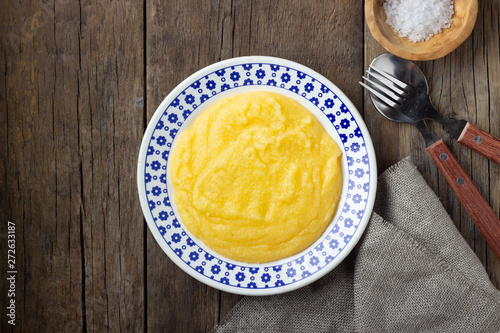 Italian food polenta on wooden table. Top view.