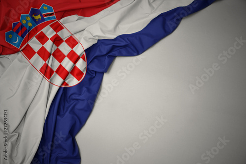 Fotografie waving national flag of croatia on a gray background.