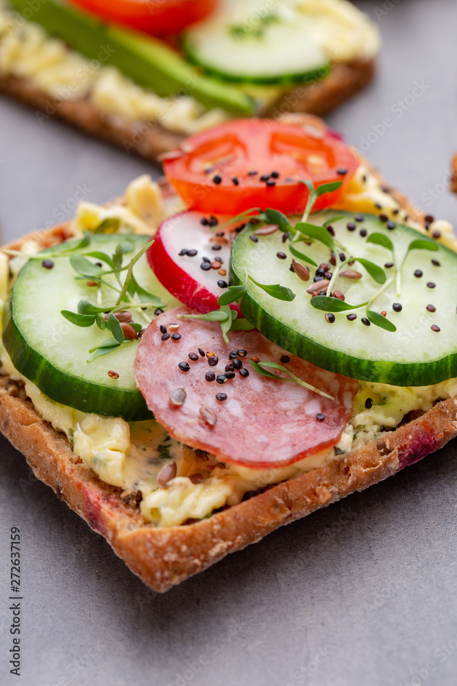 Sandwiches with cream cheese, vegetables and salami. Sandwiches with cream cheese, vegetables and salami.