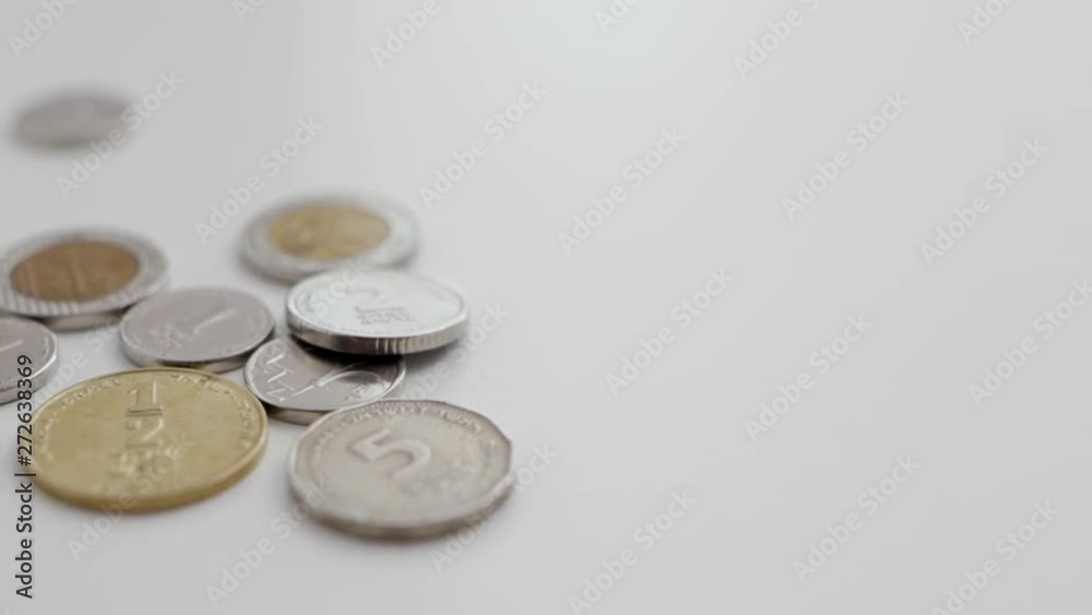 Slow pan on various Israeli coins - NIS / shekels / sheqels Slow pan on various Israeli coins - NIS / shekels / sheqels