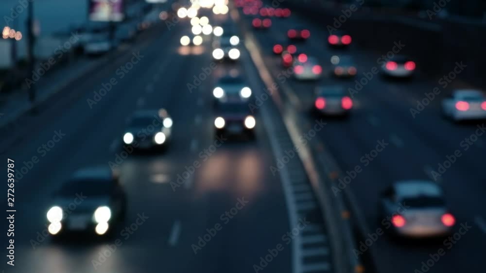 Defocused Night City Traffic Lights. Color Blurred bokeh of moving transport and typical city view Defocused Night City Traffic Lights. Color Blurred bokeh of moving transport and typical city view