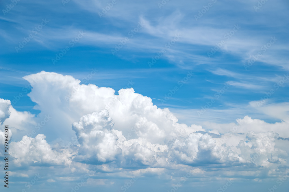 Blue sky with white and gray clouds.