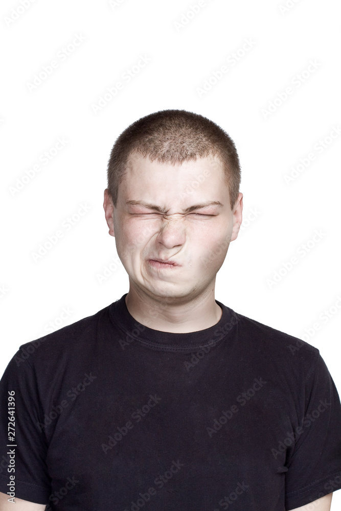 Fototapeta premium Portrait of young man. Facial expression. disgusting face.