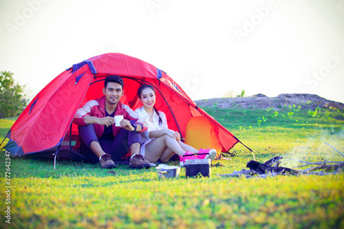 Camping places, tourists, couples, men and women are enjoying the tents and the morning nature, tourist tents and sunrise.
