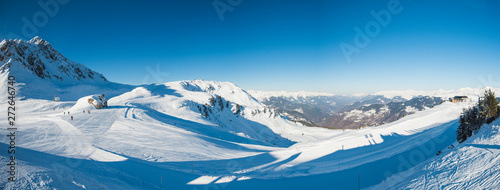 Panoramic view across snow covered alpine mountain range © Paul Vinten