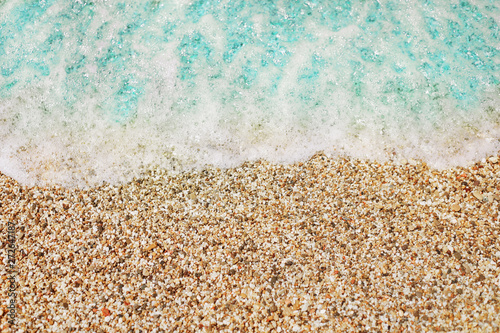 Blue sea wave on pebble beach
